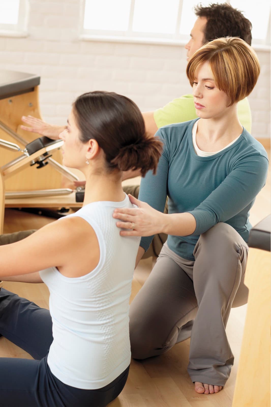 Hands-on postural correction during a one-to-one session